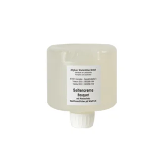 Ein flacher, runder Behälter mit einer transparenten Creme. Auf dem Etikett steht "Seidensahne Bouquet" sowie Hinweise zur Anwendung und Inhaltsstoffen. Der Behälter hat eine Verschlussöffnung an der Unterseite.