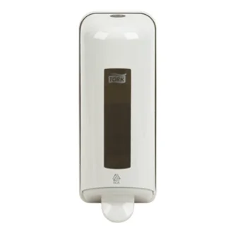 Ein weißer Seifenspender aus Kunststoff, mit einem transparenten Fenster, durch das der Füllstand der Seife sichtbar ist. An der Unterseite befindet sich ein Auslöser für die Seife. Der Spender ist für die Wandmontage gedacht und bietet hygienische Handreinigung.